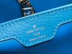 CAPUCINES MM 31 BLUE TAURILLON GOLD HARDWARE