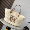 Medium anagram basket bag in iraca palm and calfskin