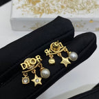 CD DioRevolution Earrings Gold-Finish Metal