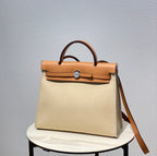 Herbag 31 Toile Light Beige Canvas Gold Cowhide Leather