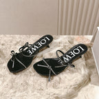 Loewe 25 Petal Bow Sandals Black Cowhide PVC