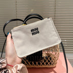 WOVEN HOLLOW BAG 23 IN BEIGE RATTAN AND BLACK CALFSKIN TRIM
