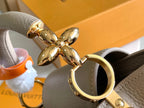 CAPUCINES BB 27 DARK BEIGE TAURILLON GOLD HARDWARE