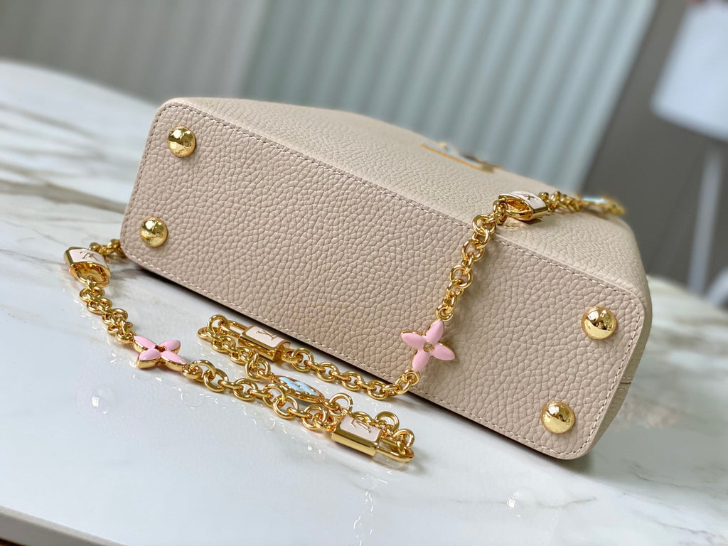 capucines bb 27 beige cloud blue taurillon leather gold hardware