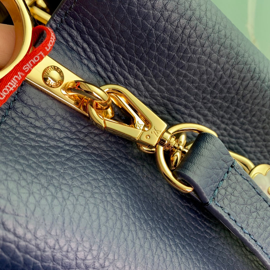 capucines mm 31.5 dark blue taurillon leather gold hardware