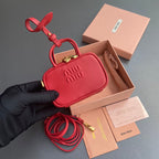 MICRO BAG KEYCHAIN 11 IN TALL POPPY RED CALFSKIN EMBOSSED LOGO